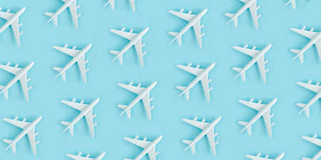 White model plane, airplane on blue background. Top view, flat lay.の写真素材