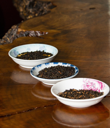 Flight of black tea in small bowlsの写真素材