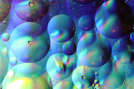 Oil droplets on water - close upの写真素材