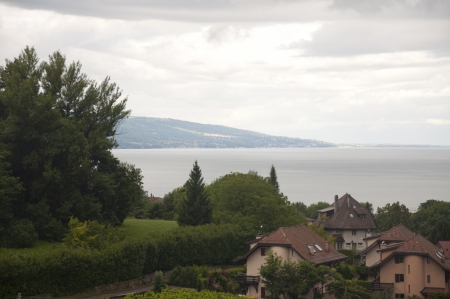 Houses by Lake Geneva on a Cloudy Dayの写真素材