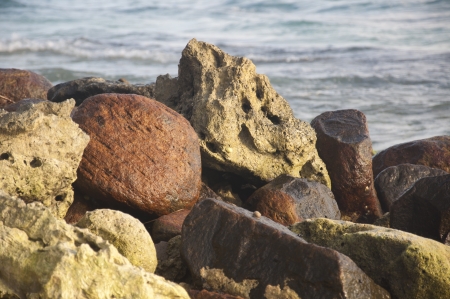 Natural rocks against the Indian ocean on a sunny dayの写真素材