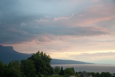 Houses and Greenery besides Lake Geneva at Sunsetの写真素材