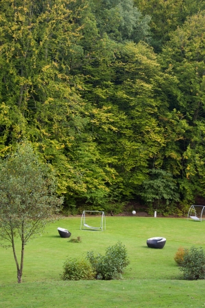 Beach Baskets or Strandkorbs, Swing Sunbeds and Wicker Sunbeds Amidst Greenery in Germany in Autumn の写真素材