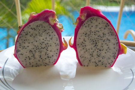 Dragon Fruit Halves besides a Swimming Pool in Goaの写真素材
