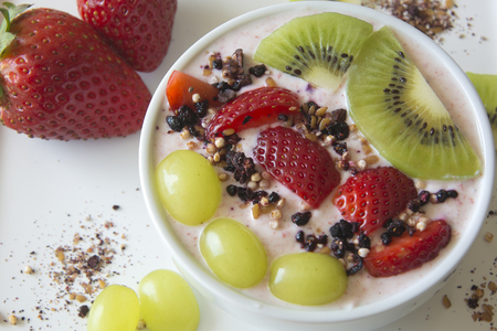 Greek Strawberry Yoghurt with Fresh Strawberries, Kiwis and Grapesの写真素材