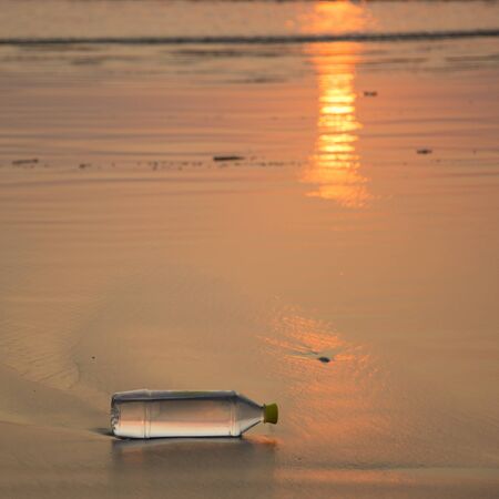 A plastic water bottle disposed off at the beach