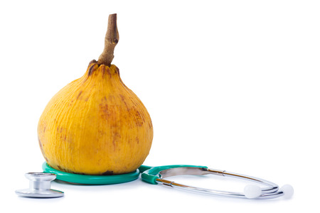 Close-up santol (meliaceae),the thai fruit  and stethoscope isolated on white backgroundの写真素材