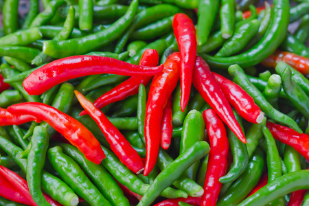 A pile of fresh chili peppersの写真素材