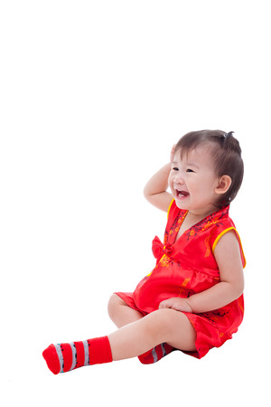 Little asian girl (thai) in traditional chinese dress, cheongsam is typical china dress, identity culture of Chinese New Year festival.の写真素材