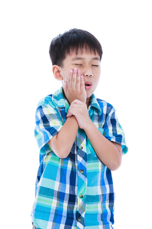 Asian handsome boy with toothache problem touching outside mouth with hand. Concept about oral health. Isolated on white background. Negative human emotion, facial expression feeling reaction. Studio shot.の写真素材