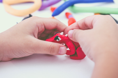 Close up. Child playing and creating toysの写真素材