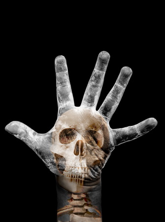 Image for poster or t-shirt print of human skull combined with dirty palm can be used for halloween background. Isolated on black background.の写真素材