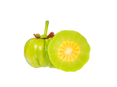 Garcinia cambogia fresh fruit, isolated on white. Garcinia atroviridis is a spice plants and high vitamin C and hydroxy citric acids (HCA) for diet and good health.の写真素材