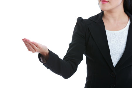 Closeup of woman showing hand up, empty copy space on open hand palm for advertise slogan or text message. Focus on hand. Business woman in black suit. Isolated on white background. studio shot.の写真素材