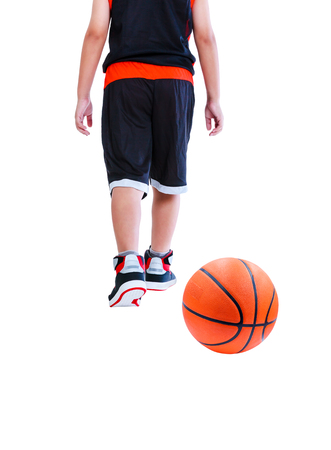 Back view of young asian child in sportswear back walking. Basketball on floor. Studio shot. Isolated on white background.の写真素材