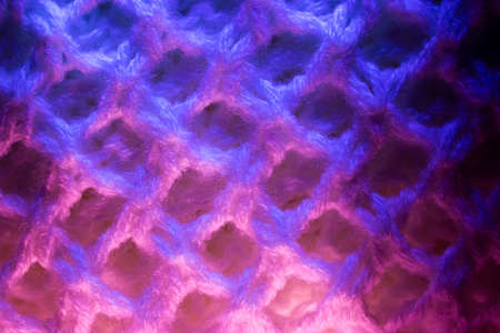 Close-up of fluffy soft textile. Abstract fabric with knit texture for background.の写真素材