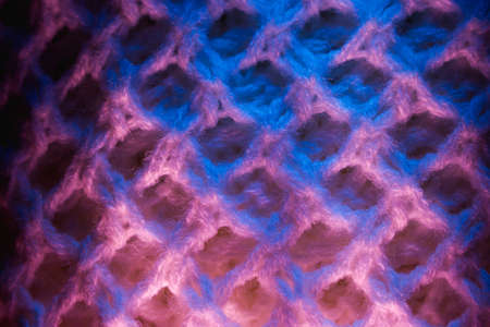 Close-up of fluffy soft textile. Abstract fabric with knit texture for background.の写真素材
