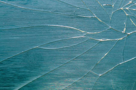 Broken mirror. Cracked glass texture on abstract background.の写真素材