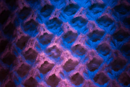 Close-up of fluffy soft textile. Abstract fabric with knit texture for background.の写真素材