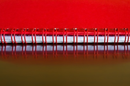 Head of the desktop red calendar placed in a horizontal position.