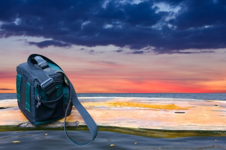 Green handbags and long bridge of wood  which lies in the waters cloudy sky の写真素材