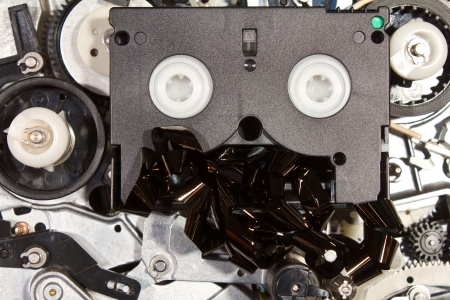 Mini DV to damage in the mechanism of broken VHS player の写真素材
