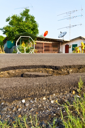 Low angle of the asphalt to break a residential house located opposite の写真素材