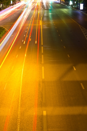 Abstract traffic of light vehicles running on the road in the city の写真素材