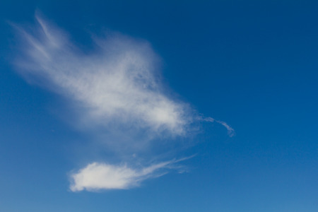 Smoke clouds in the sky gathering and distribution of abstract shapes の写真素材