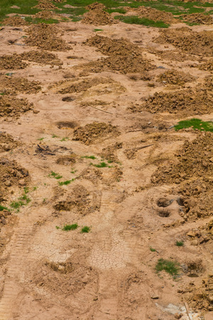 Background, top angle view of a pile of gravel and sand, which pitted の写真素材