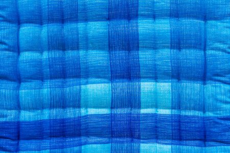 Close up background beautiful blue and white corrugated bed quilt.の写真素材