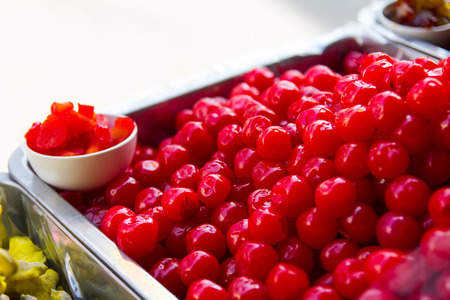 Red cherry fruit preserves many beautiful stack of delicious desserts.の写真素材
