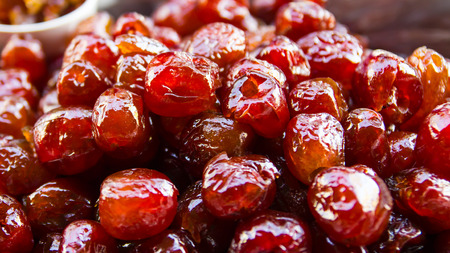 Prunes in syrup, sweet, juicy and delicious, the preservation of fruit to eat.