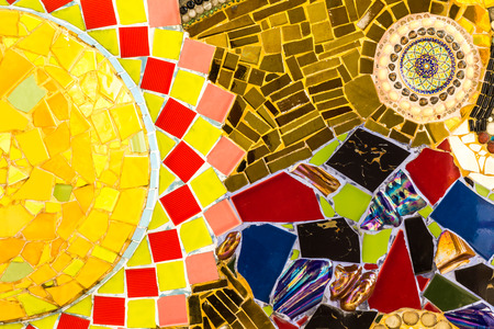 Background wall tiles cracked plate with colorful exotic patterns and debris.