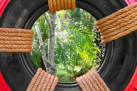 Close up of recycled rubber garden decoration tied with string Manila strong.の写真素材