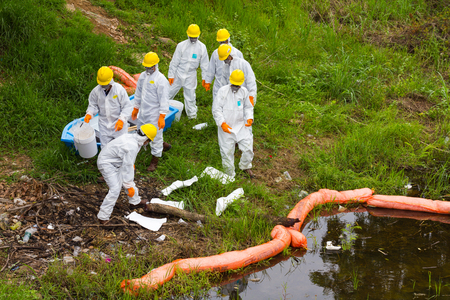 PHICHIT THAILAND-AUGUST 7:Scientific staff wear uniforms to prevent toxic chemical waste are stored...