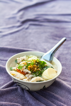Close up of soft boiled tofu with minced pork meatballs and place on a towel delicious purple.の写真素材