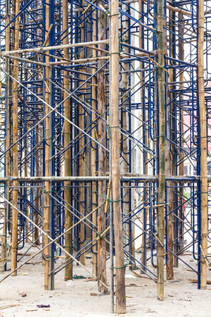Close up on bamboo scaffolding steel, which is currently serving temporary bracing in construction.