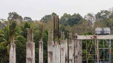 Reinforced concrete pillar, which is building a base of a large building in the countryside.の写真素材
