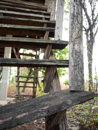 Close ruins of old wooden staircase in an abandoned rural house.の写真素材