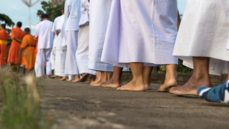Close your legs and feet of the priests and worshipers were walking meditation on the concrete.の写真素材