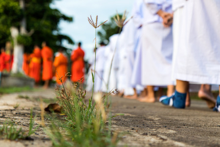 Close your legs and feet of the priests and worshipers were walking meditation on the concrete.