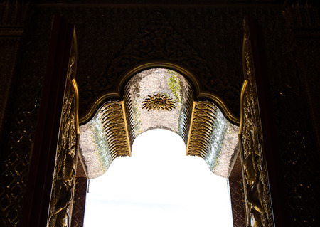 Close up view of the inside of a Buddhist church entrance through to the outside.の写真素材
