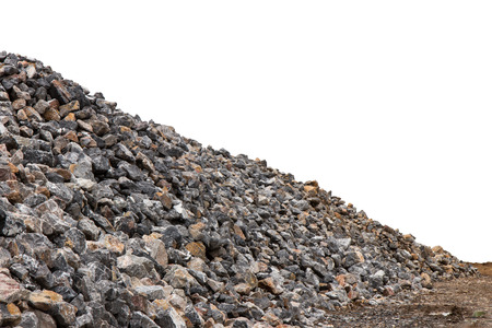 Isolate pile of granite rocks, small lot on the ground prepared for construction.の写真素材