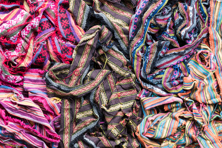 Fabric pieces are woven with a variety of colorful yarns, and the rest of the patchwork is neatly...