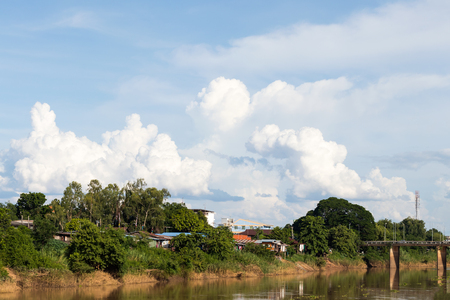 River countryside views in rural areas, residential homes with trees, where the sky is the backdrop.の写真素材