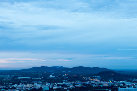 Mountain views with early morning residential buildings with overcast clouds above.のeditorial素材