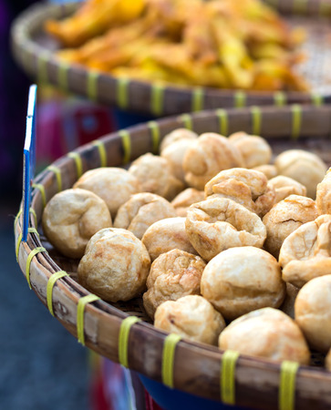 Close-up of crispy pork balls made from crushed fish fillets in bamboo baskets are commonly found in Thai rural markets.の写真素材