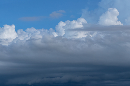 Background Cloudy sky, which is forming rain because of the storm in the blue sky.の写真素材