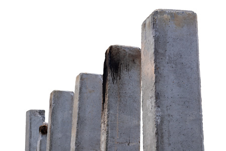 Isolated low-angle view near the cement column stained with oil stains installed to be a bridge pillar in a rural area.の写真素材